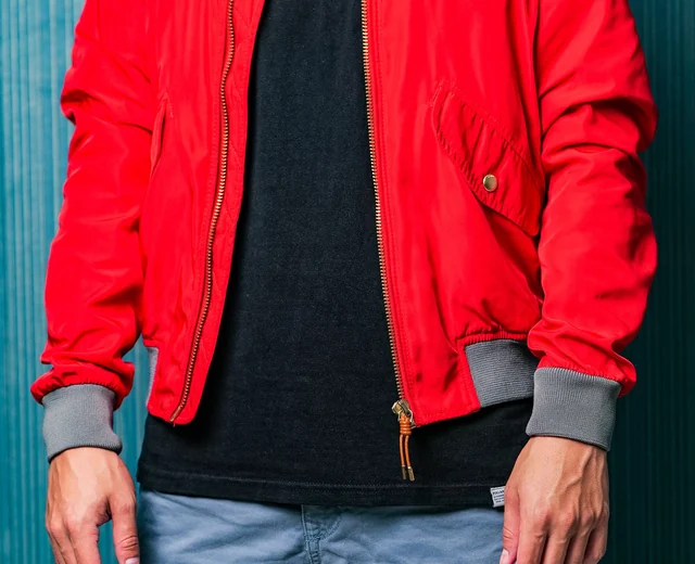 Red bomber jacket with grey rib knit collar and cuffs, a style for custom bomber jackets